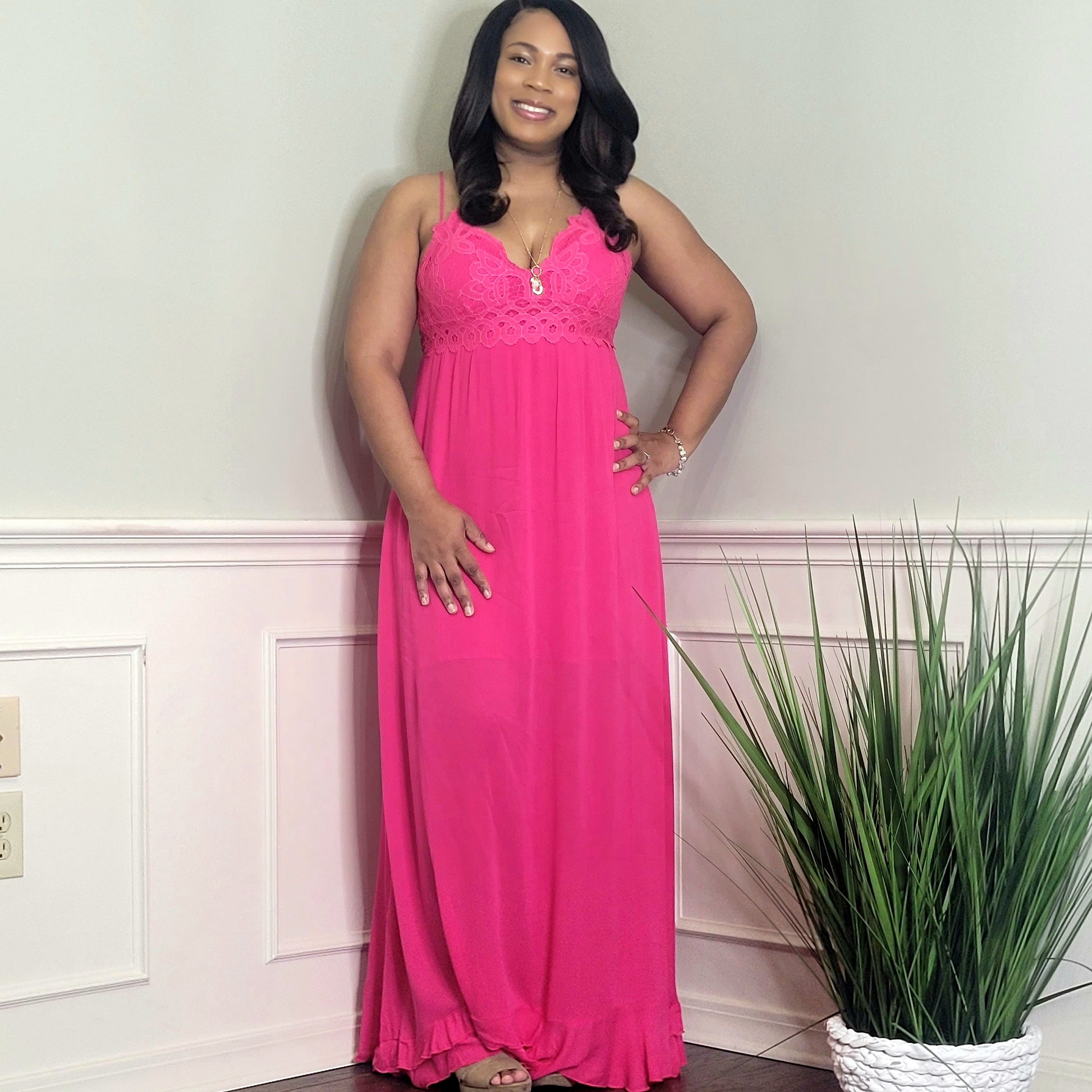 Model wearing a pink crochet top spaghetti strap dress front view